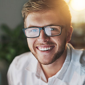 Man smiling wearing eye glasses after using DialCare